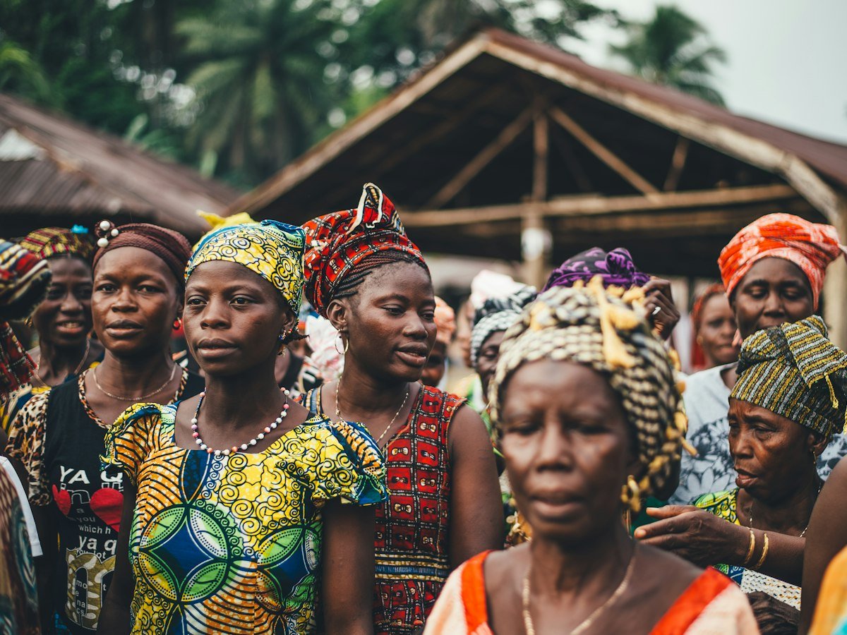 Women of all ages gathered together at a community meeting
